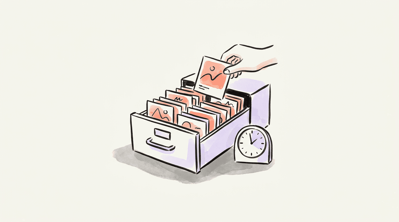 An archive drawer holding post cards beside a clock