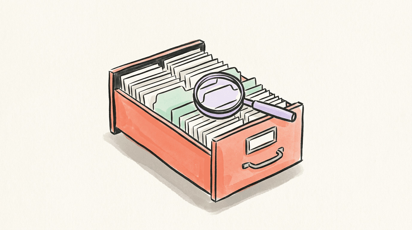 A filing drawer of conversation cards with a magnifying glass over one divider