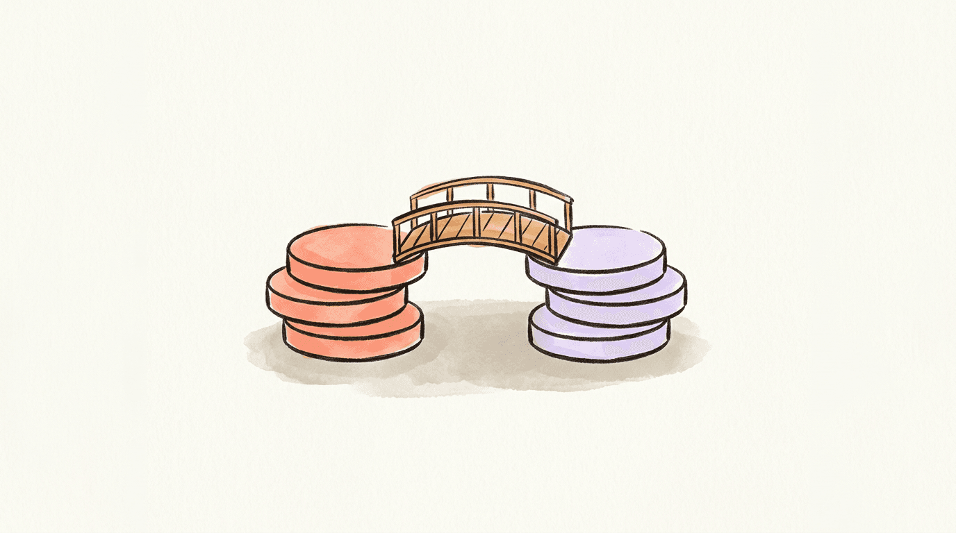 A stack of coral discs and a stack of lavender discs joined by a small arched wooden footbridge